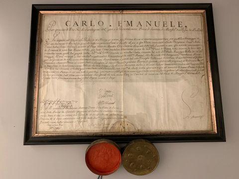 Editto del re Carlo Emanuele III di Savoia in cui viene concessa, allo speziale Franco Andrea Trono e ai suoi eredi, la sede farmaceutica sulla piazza di Cuneo, 28 maggio 1732 